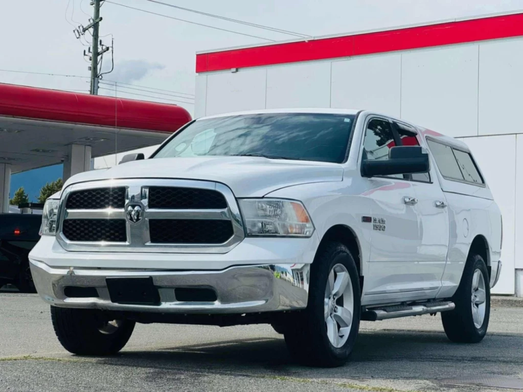 Used 2014 RAM 1500 4WD QUAD CAB 140.5 SLT 
